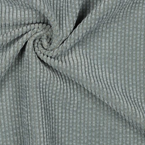 Zbliżenie na szałwiowy materiał sztruksowy, ukazujący charakterystyczne prążki i miękką teksturę.