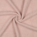 Miękkie i puszyste futerko materiałowe w delikatnym różowym odcieniu, doskonałe do projektów krawieckich