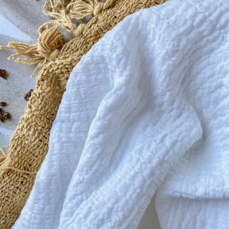 Muślin w kolorze śmietanowym z elastanem